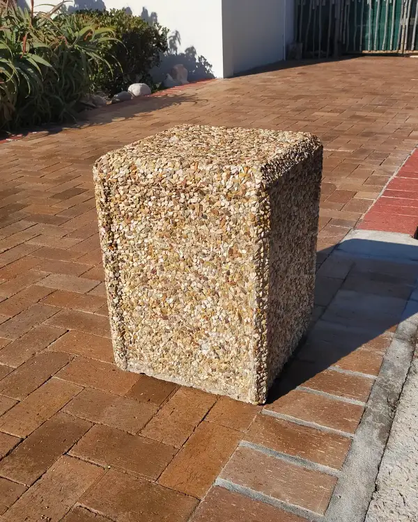 4040 Cube free-standing precast concrete bollard with an exposed aggregate finish