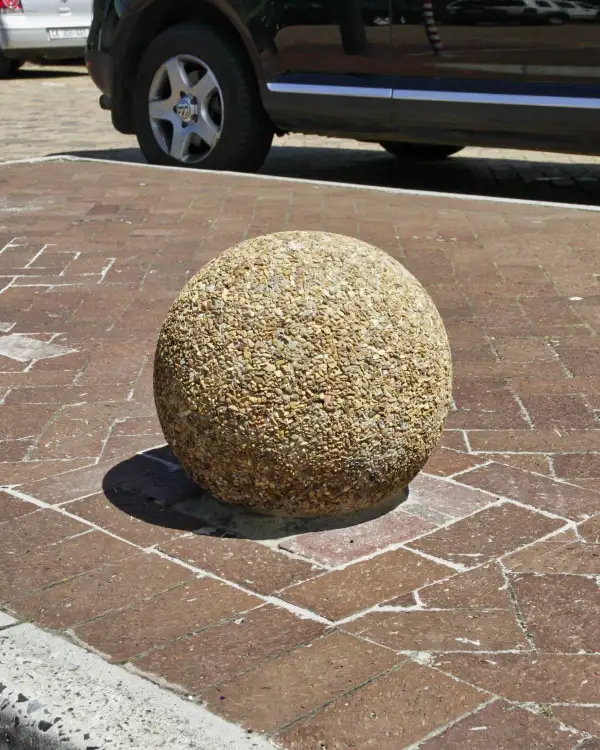 Ball 400 spherical precast concrete bollard with an exposed aggregate finish