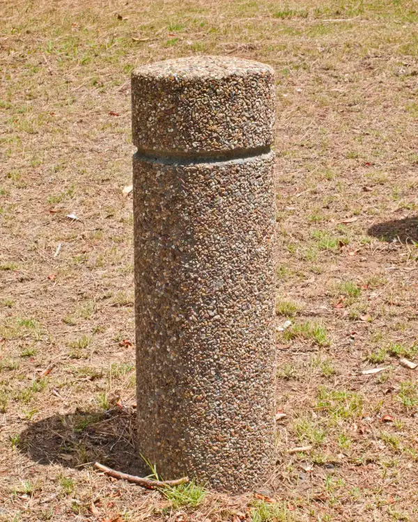 Bloc 250 round precast concrete bollard with an exposed aggregate finish