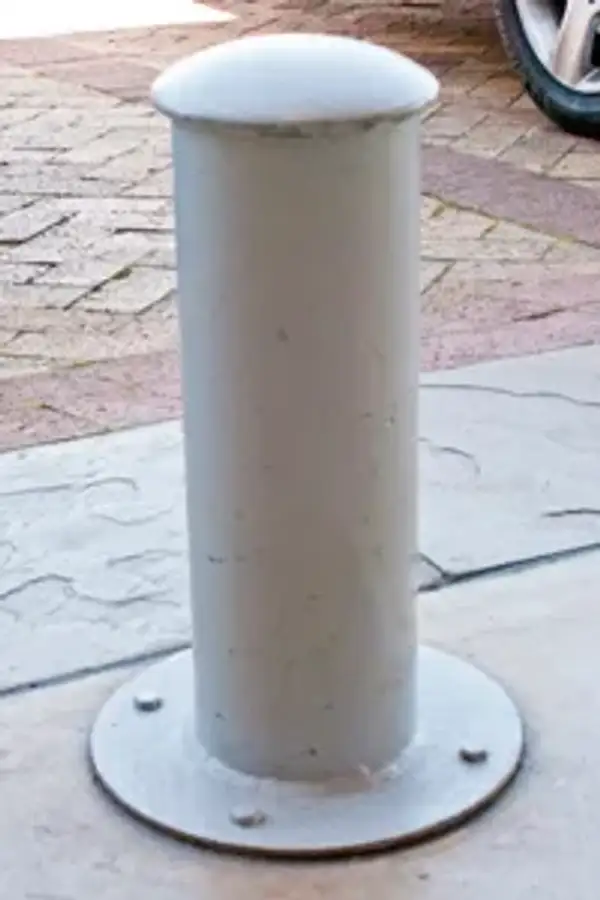 Low, dome-topped Quay steel bollard bolted onto a round surface baseplate