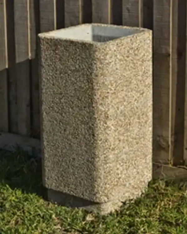 Square 400 open-top precast concrete bin with a chamfered cast rim, standing on grass against a timber fence