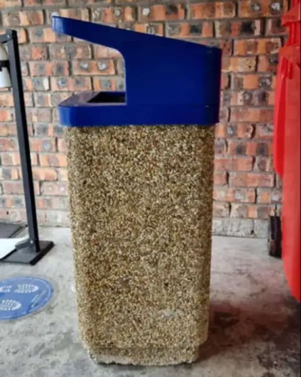 Square 405 precast concrete bin with a blue powder-coated steel canopy cantilevered over the opening