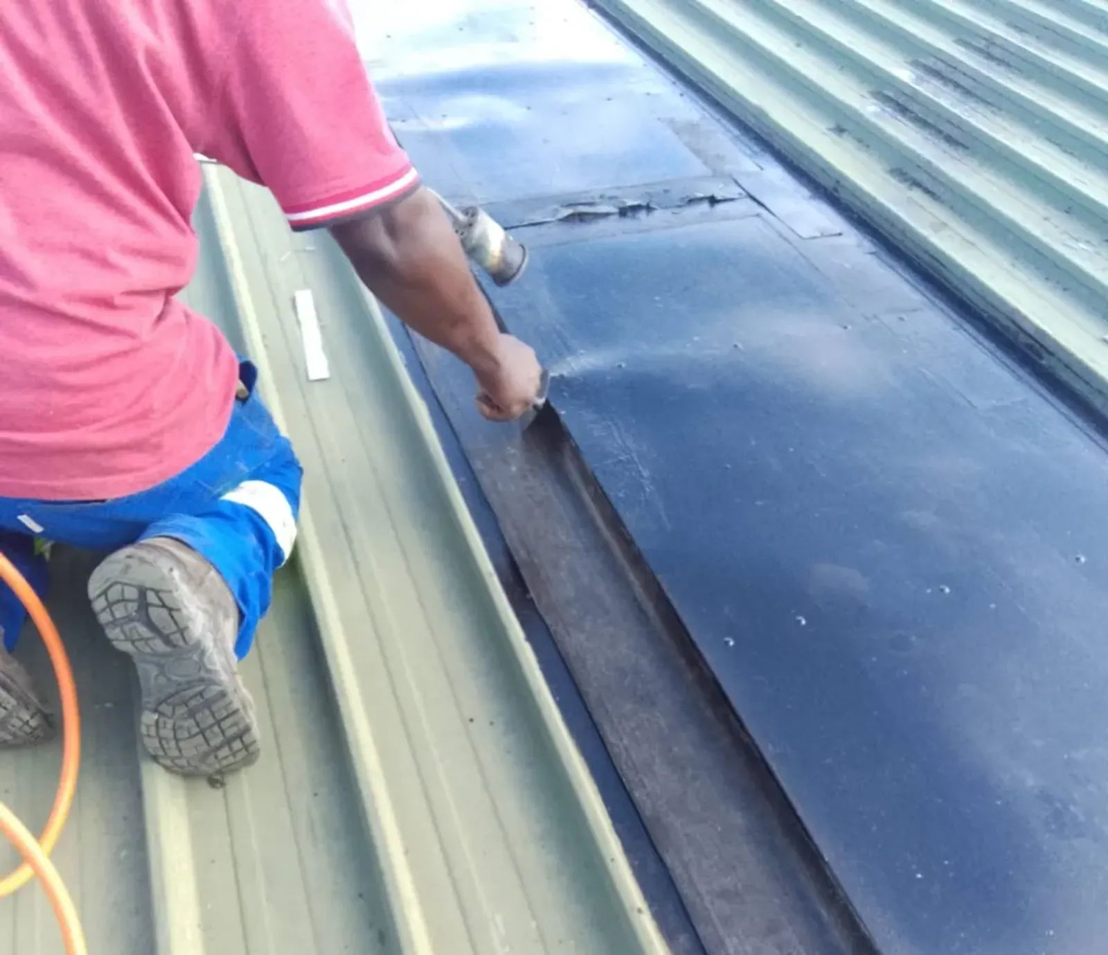 Torch-on waterproofing carried out on an Epping Industria roof by 68 Projects Building Co